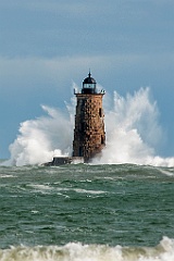 Waves Surround Stone Whaleback Lighthouse Tower in Maine